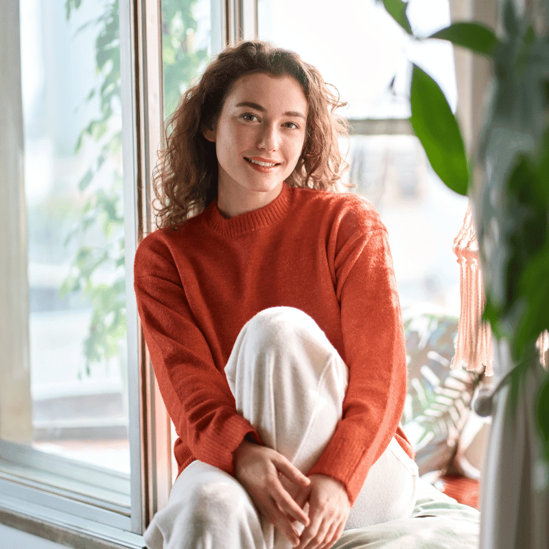 Woman in an online therapy session on her laptop