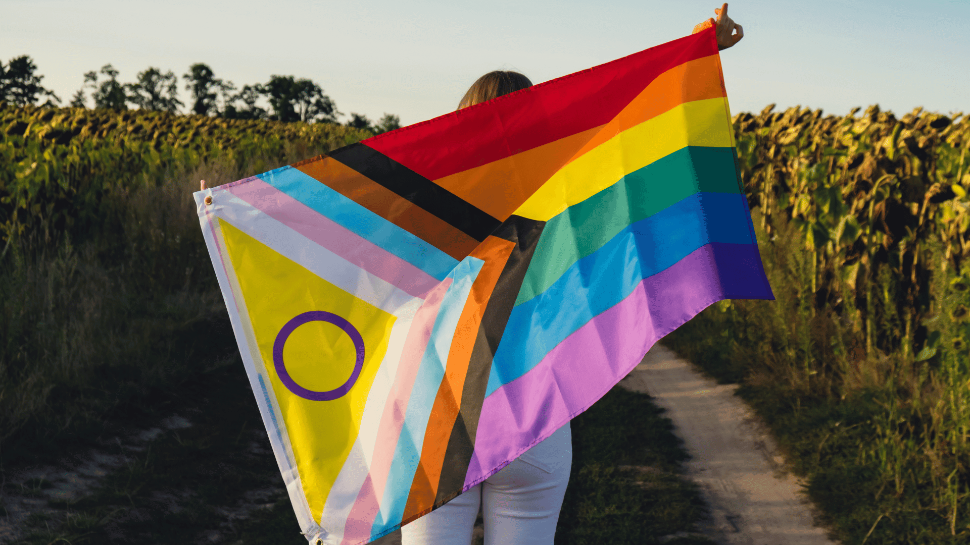 Diverse group of LGBTQ+ individuals in a supportive therapy session