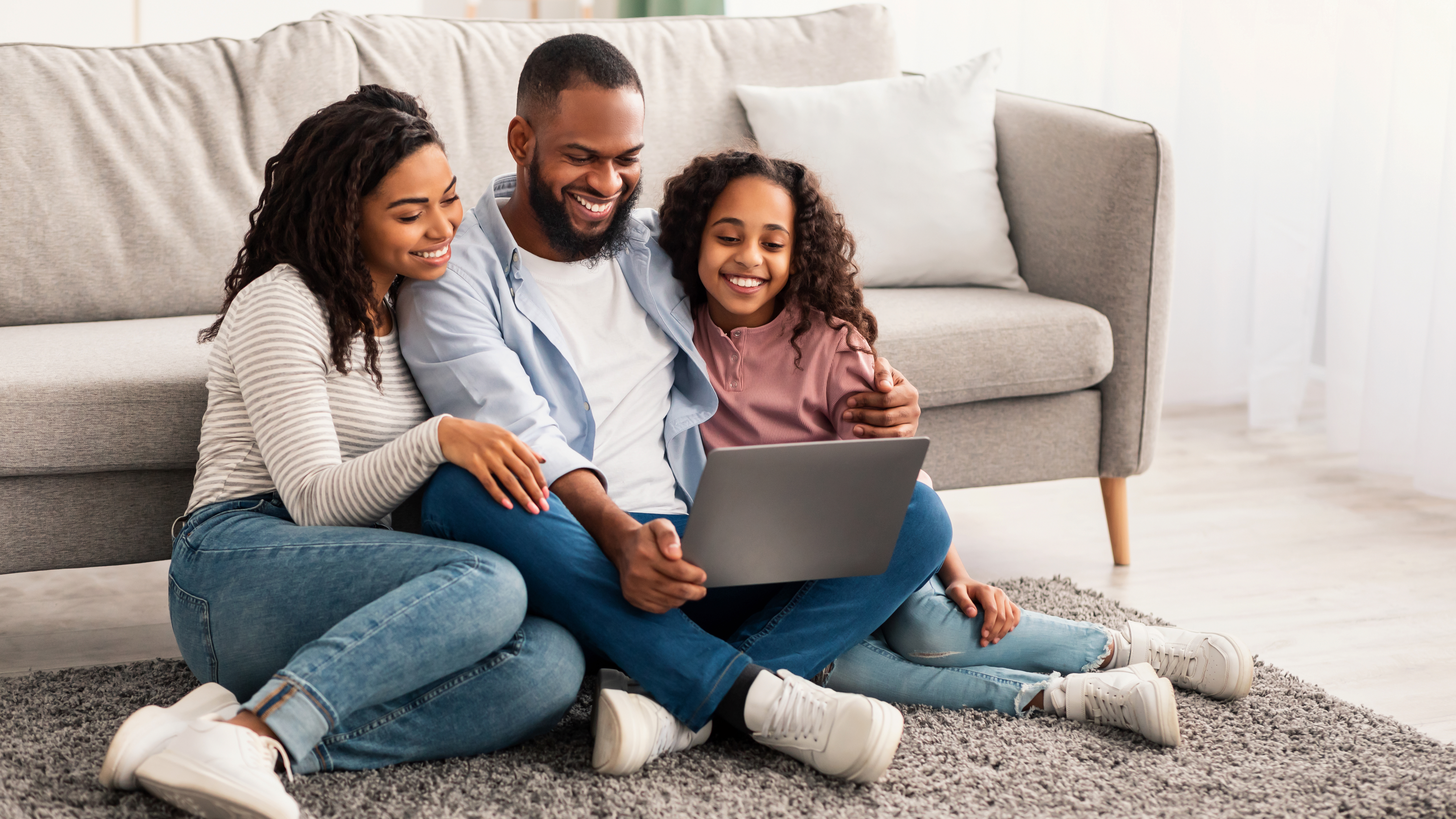 Happy family enjoying online therapy session together