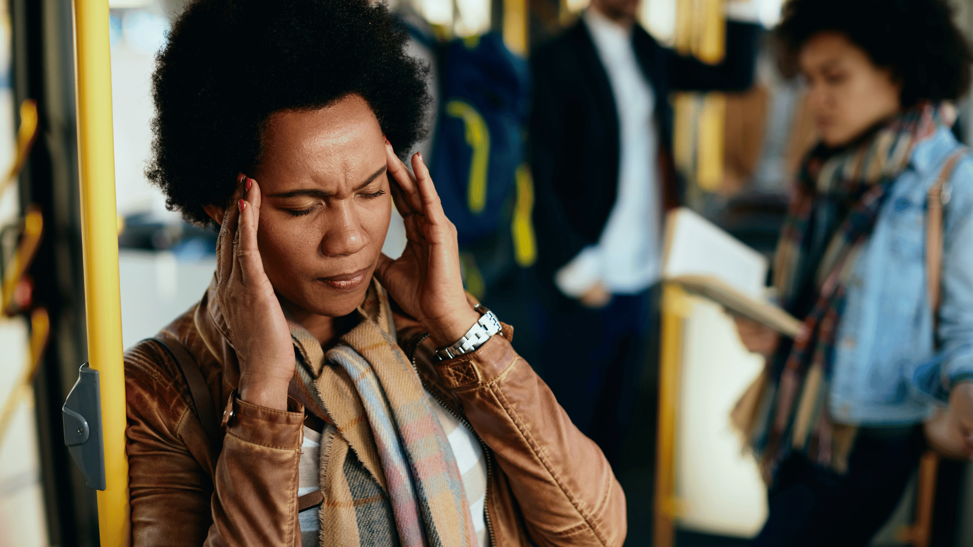 Person experiencing stress symptoms in a public setting