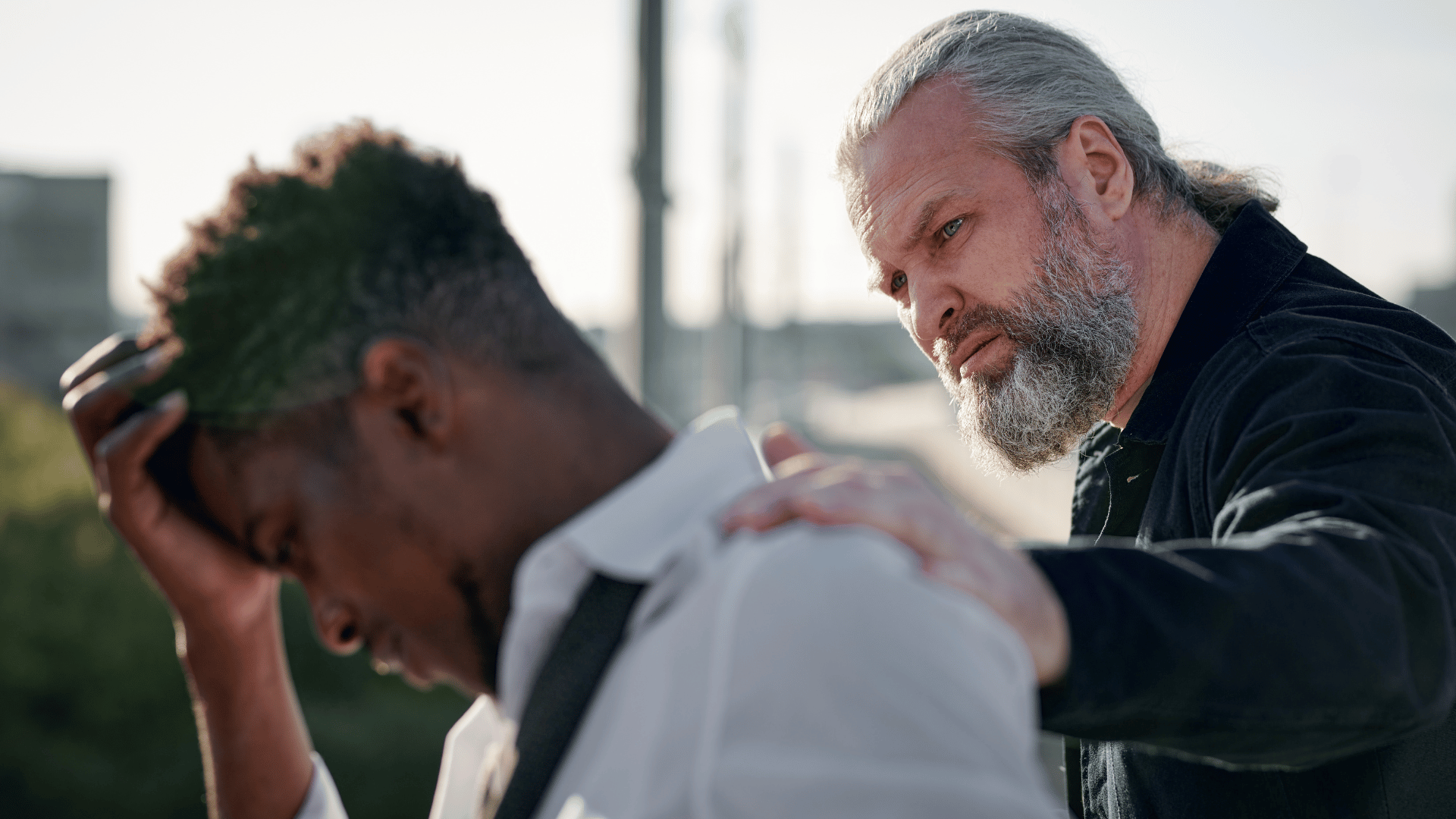 Person receiving compassionate support during a moment of grief